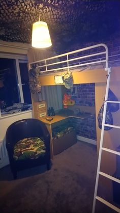 a room with bunk beds and a chair