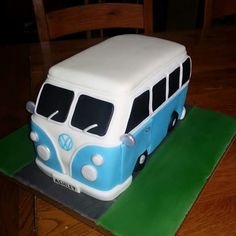 a blue and white cake with a vw bus on it