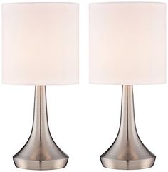 pair of modern chrome finish table lamps with white linen shades