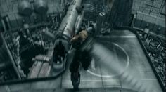 a man standing on top of a ship next to another person