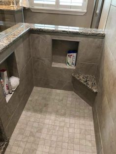 a walk in shower sitting next to a window