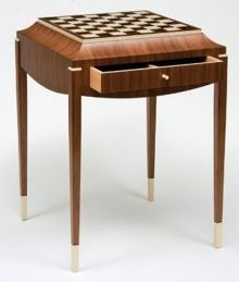 a wooden table with a chess board on it's top and drawer open to reveal a checkerboard pattern