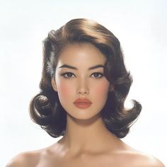 ↑↑↑ Larger size on website 🔸 A woman with dark, wavy hair styled in a 1950s bouffant looks directly at the camera. Her makeup is 1950 Hairdo, 1960s Wavy Hair, Makeup In 1950, Vintage Hairstyle Short Hair, Retro Hair Short, Hair Styles 1950, 1950 Style Hair, 1950s Style Hair, 1950s Hair Style