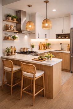 a kitchen with two stools next to an island
