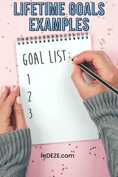 someone writing on a goal list with the words life time goals examples