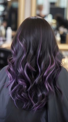 Rich black roots blend into layered curls with vibrant purple accents, giving this look a dramatic and artistic finish. Perfect for expressing individuality, this Dark Hair Color 2025 idea brings together elegance and boldness in a unique salon-worthy finish. Purple Highlights On Hair, Purple Tips On Black Hair, Hair Colour Purple Highlights, Black Hair And Purple Highlights, Colored Balayage Hair, Black And Purple Highlights Hair, Light Purple Highlights Black Hair, Black Hair With Purple Lowlights, Black Hair With Light Purple Highlights