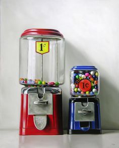 two gummy machines sitting next to each other on top of a white countertop
