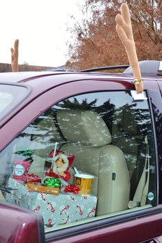 a car with christmas presents in the back seat