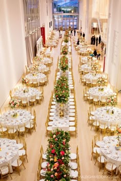 an indoor banquet hall with tables and chairs set up for formal dinner or wedding reception