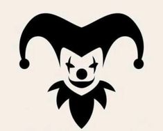 a black and white image of a clown's face