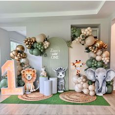 an animal themed birthday party with balloons and decorations