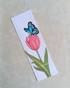 a card with an image of a butterfly on top of a tulip and the words happy mother's day written below it