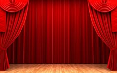 an empty stage with red curtains and wooden floor