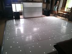 a white dance floor with lights on it