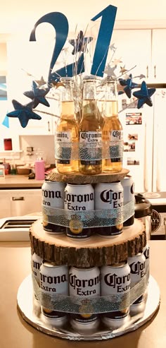 a cake made to look like beer cans stacked on top of each other with blue stars