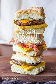 three biscuits stacked on top of each other with the words freezer biscuit sandwiches