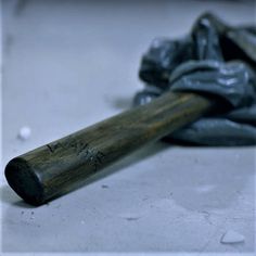 an old baseball bat laying on the ground