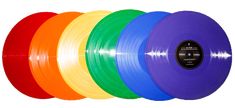 five different colors of vinyl records on a white background