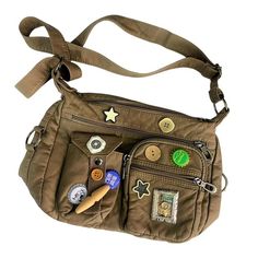 PRICES MAY VARY. 【Multiple Compartments】 This Y2K button bag comes with 7 pockets to amply store your items. It features 2 zippered pockets and 1 slip pocket on the front, 2 zippered pockets on the top, 1 zippered pocket on the back, and 1 zippered pocket inside. The compact structure and spacious interior provide ample space to carry and organize essentials like your phone, wallet, card holder, power bank, makeup accessories, and stationery, keeping everything neatly in place and handy for your Bag Styles, My Accessories, Brown Back To School Bag With Adjustable Strap, Khaki Shoulder Bag With Multiple Pockets, Grunge Style Purse, Bag Ideas, Affordable Y2k Satchel Bag, Multifunctional Khaki Bag With Multiple Pockets, Cheap Y2k Satchel Shoulder Bag
