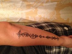 a person with a tattoo on their arm