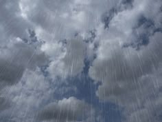 the sky is filled with rain and clouds