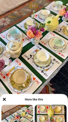 an image of a table setting with flowers and china on it for dinner or tea party