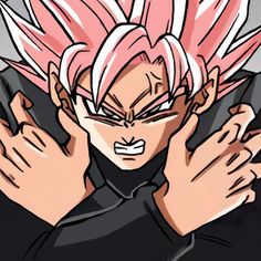 a close up of a person with pink hair holding his hands in front of him