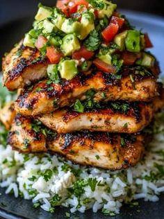 grilled chicken with avocado salsa on top of rice