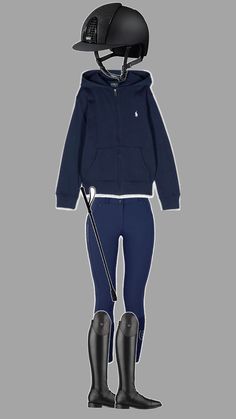 a child's horse riding outfit with boots and a helmet on the head, standing in front of a gray background