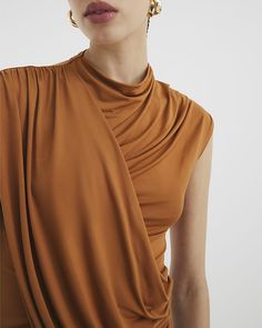 Crew neckline Sleeveless Wrap design Draped style Draped Tops, Summer Drape Top, Sleeveless Draped Fashion, Drape Top, Versatile Draped Summer Top, Drape Front Top, Silk Draped Top Fashion Inspiration, Elegant Drapey Sleeveless Top, Draped Tank Top