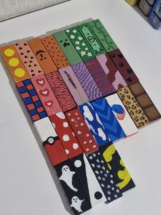 several different colored strips of paper on a table