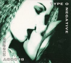 a black and white photo of a woman's face with her eyes closed in front of the camera