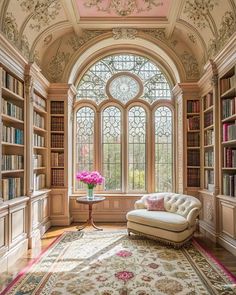 a room with many bookshelves and a couch in it