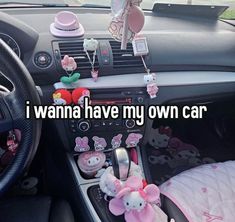 the inside of a car with hello kitty decorations hanging from it's dash board