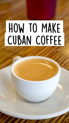 a cup of coffee sitting on top of a white plate with the words how to make cuban coffee