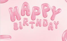 the words happy birthday are spelled with pink balloons