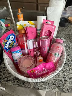a white basket filled with lots of pink items