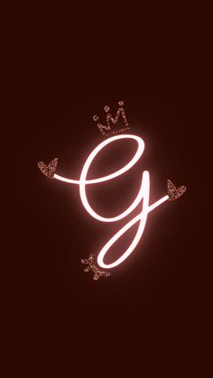 the letter g is lit up with neon lights and sparkles on it's side