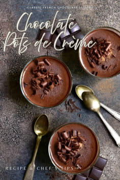 Overhead view of classic French chocolate pots de crème served in ramekins topped with chocolate shavings on a dark textured surface.