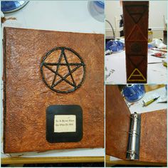 a book with a pen on it and a pen in the cover that has a pentagram attached to it