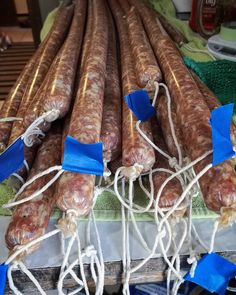 several sausages are wrapped in twine and tied together