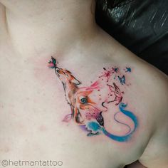 a woman with a tattoo on her chest has a fox and butterfly design on it