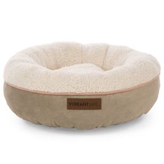 a dog bed that is beige and has a brown label on the front of it