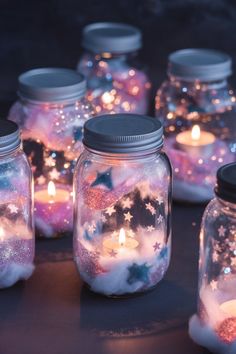 mason jars filled with stars and candles on top of a table