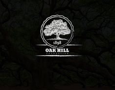 the oak hill foundation logo is shown in front of a dark background with lots of trees