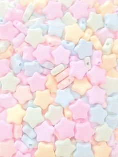 pastel colored stars are scattered on top of each other