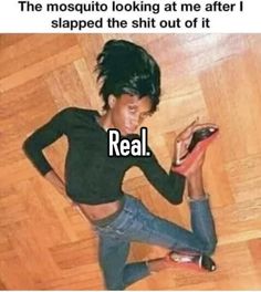 a woman laying on the floor looking at her cell phone and texting, real