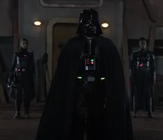 darth vader standing in front of other men