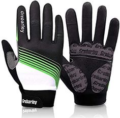 a pair of black and white gloves with green trimmings on the palm,
