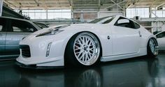 a white sports car parked in a garage